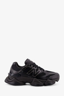 New balance men’s black mesh sneakers with chunky textured sole and subtle gray logo detailing