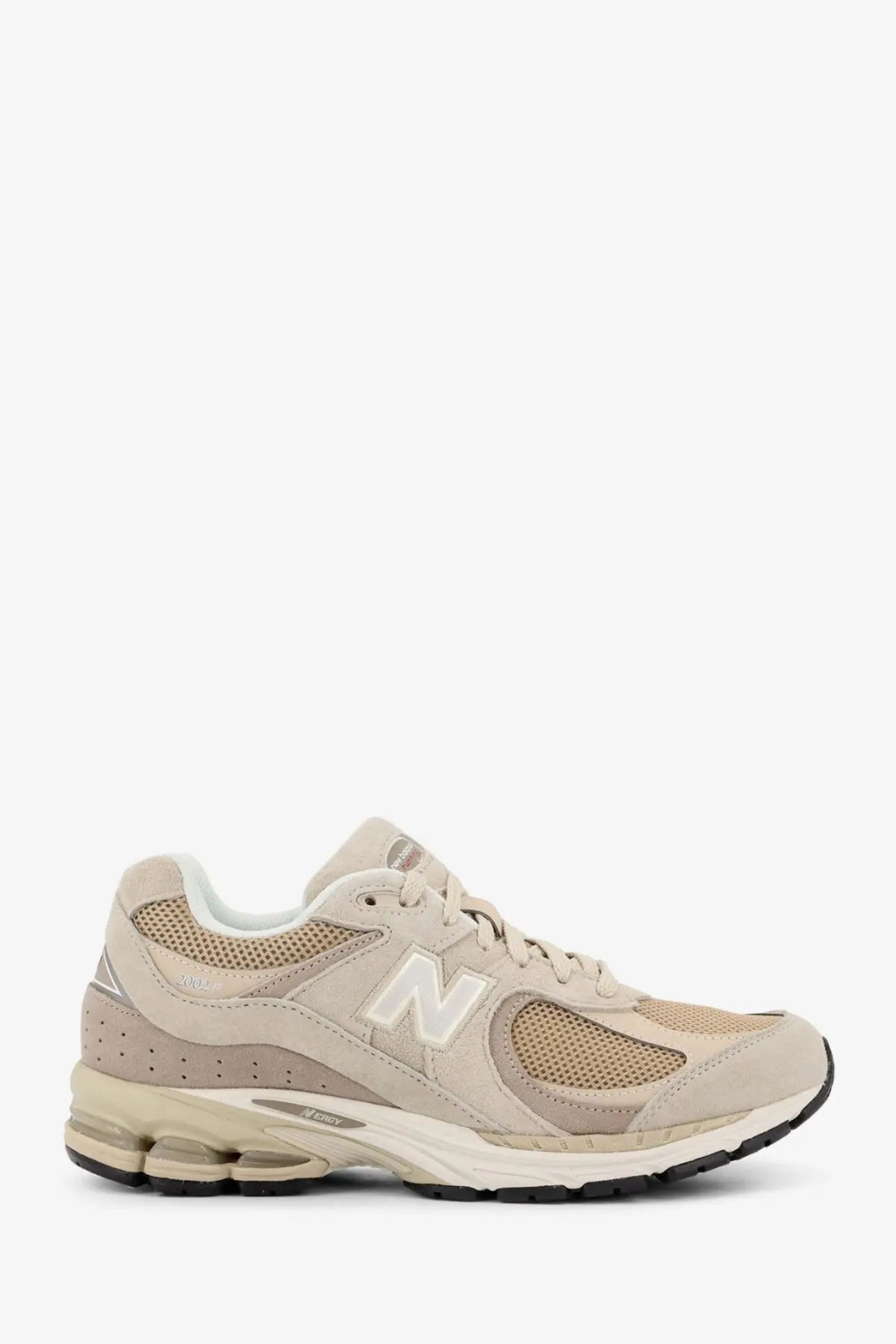 Beige new balance 2002 men’s mesh sneaker with suede upper white logo and cushioned midsole close-up view