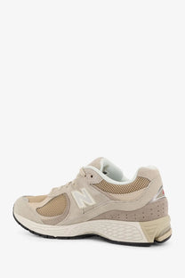 New balance men’s mesh sneakers blue with beige mesh and suede upper white logo and textured rubber sole