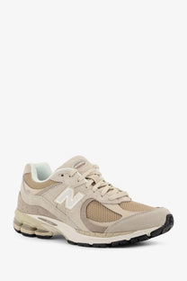 New balance men’s beige 2003 sneaker with mesh and suede upper white logo and cushioned sole