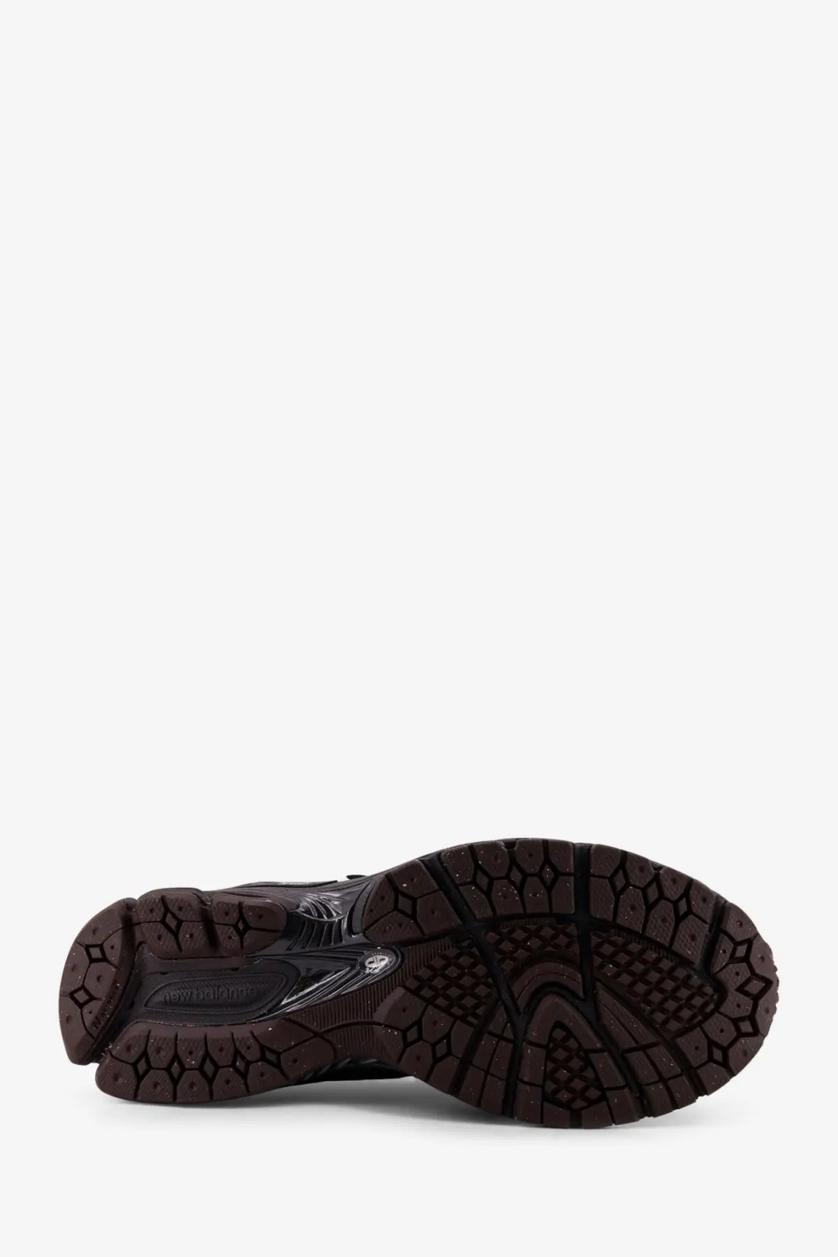 Black rubber sole with textured geometric tread and translucent accents on new balance men’s grey mesh sneakers