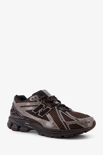 New Balance men’s mesh sneakers grey featuring brown and gray snakeskin pattern with black laces and rubber sole