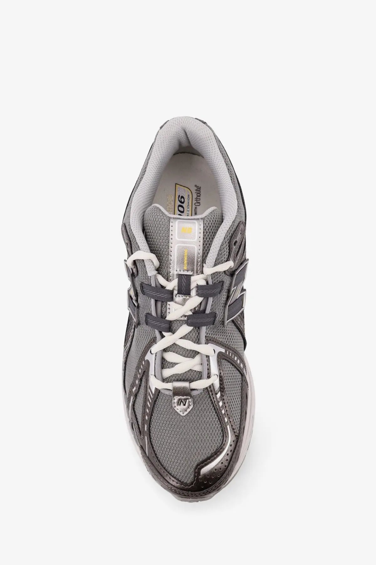 New Balance men’s mesh sneakers grey showing the back with gray upper white laces and metallic silver heel tab