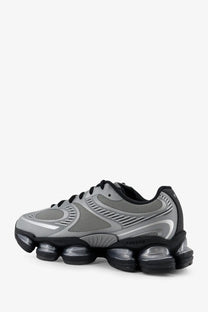 New balance men’s mesh sneakers grey athletic shoe with gray and black mesh upper and transparent air-cushioned soles