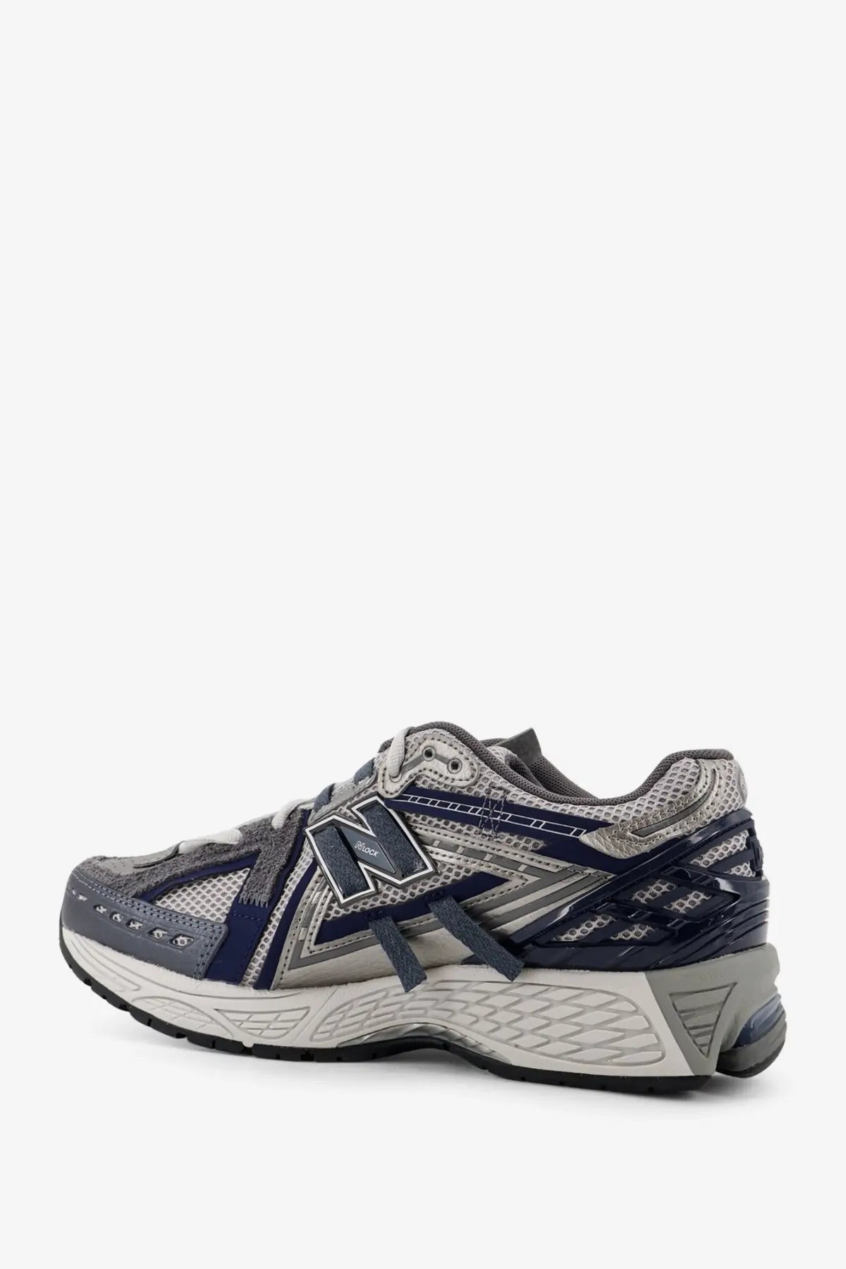 New balance men’s mesh sneakers grey featuring gray and navy blue running shoe with mesh and synthetic overlays