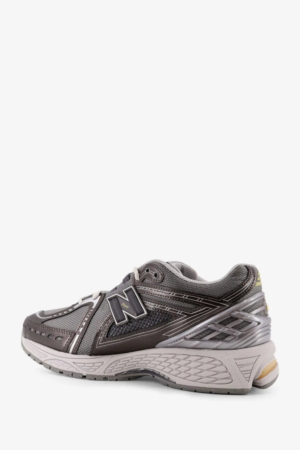New balance men’s grey mesh sneakers 2003 with grey and silver mesh upper rubber sole and metallic logo