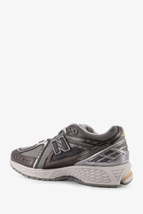 New balance men’s grey mesh sneakers 2003 with grey and silver mesh upper rubber sole and metallic logo