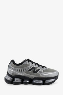 New Balance men’s mesh sneakers grey with silver and black air-cushioned sole for running and casual wear