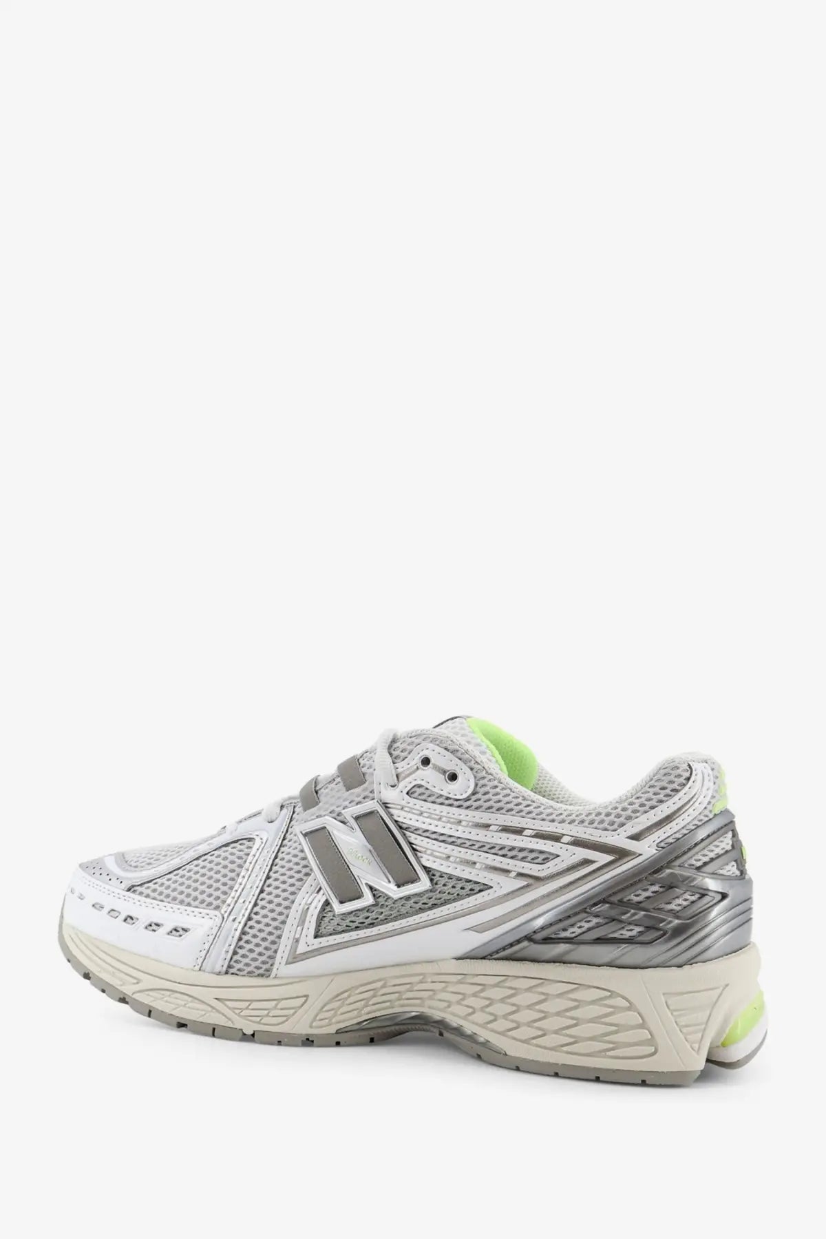 New Balance men’s mesh sneakers in silver and white with neon green accents designed for running