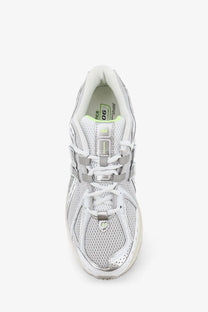 New Balance men’s mesh sneakers grey with white and silver mesh, metallic accents, and lime green interior lining