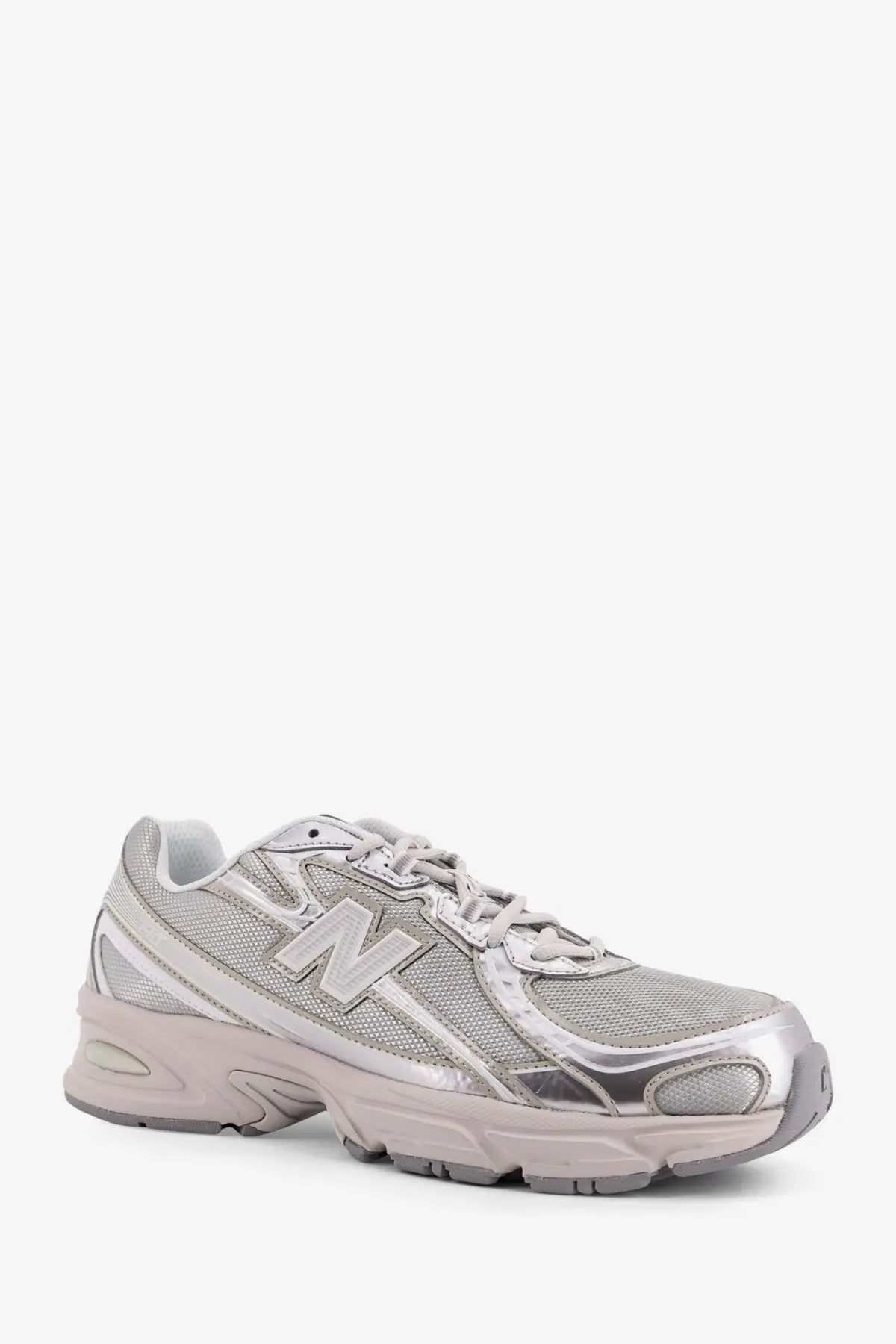 New balance men’s silver sneaker with mesh and synthetic overlays for lightweight comfort and style