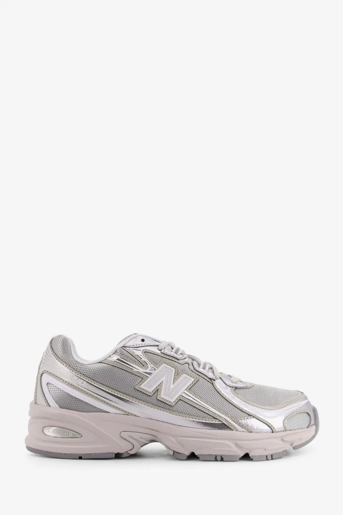 New balance men’s silver mesh sneakers with synthetic overlays and chunky midsole for casual wear
