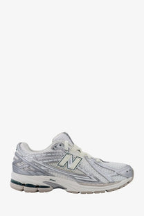 New Balance men’s mesh sneakers silver with white and silver mesh upper and cushioned sole for running