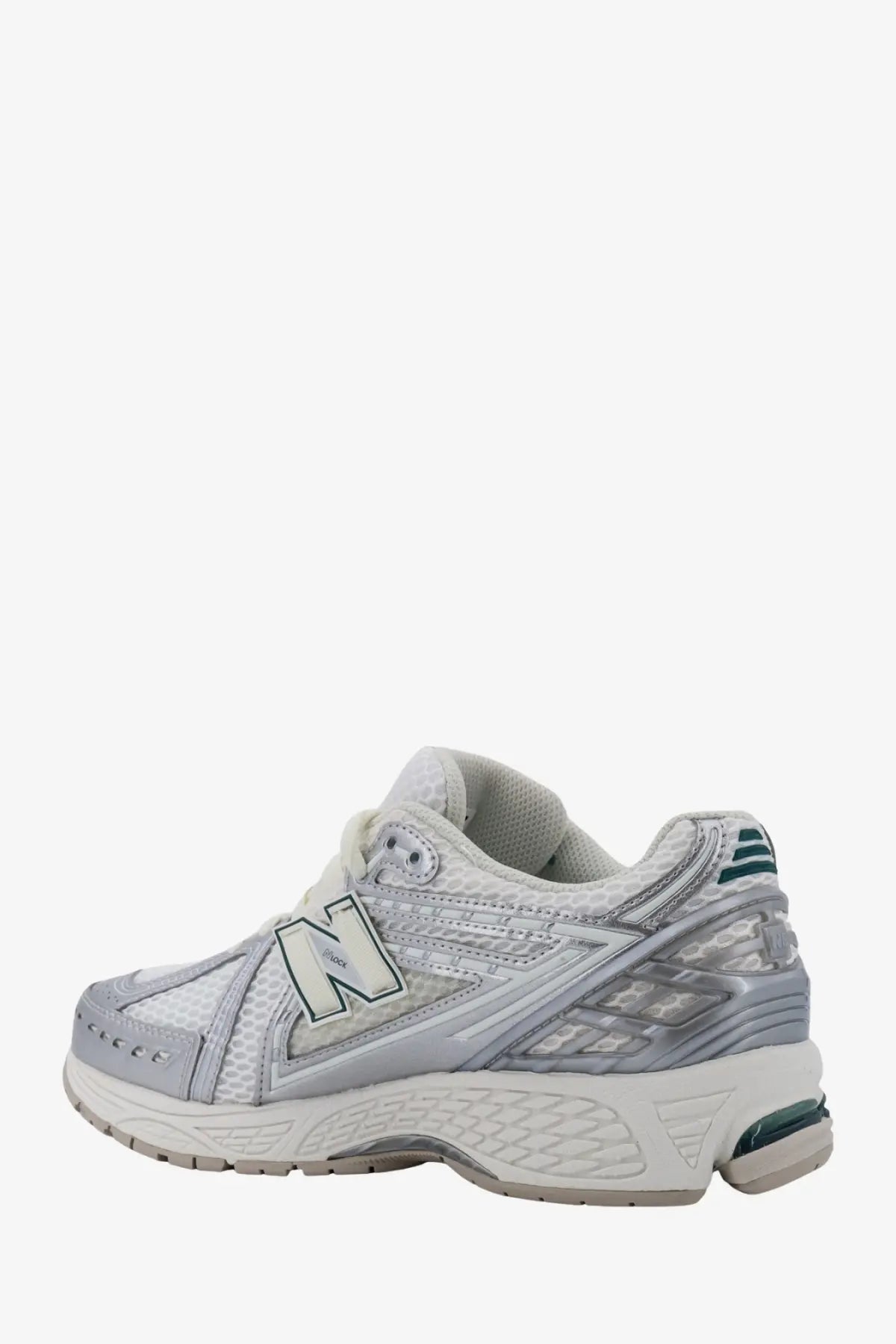 New balance men’s mesh sneakers in white and silver with mesh upper, reflective accents, and teal heel detailing