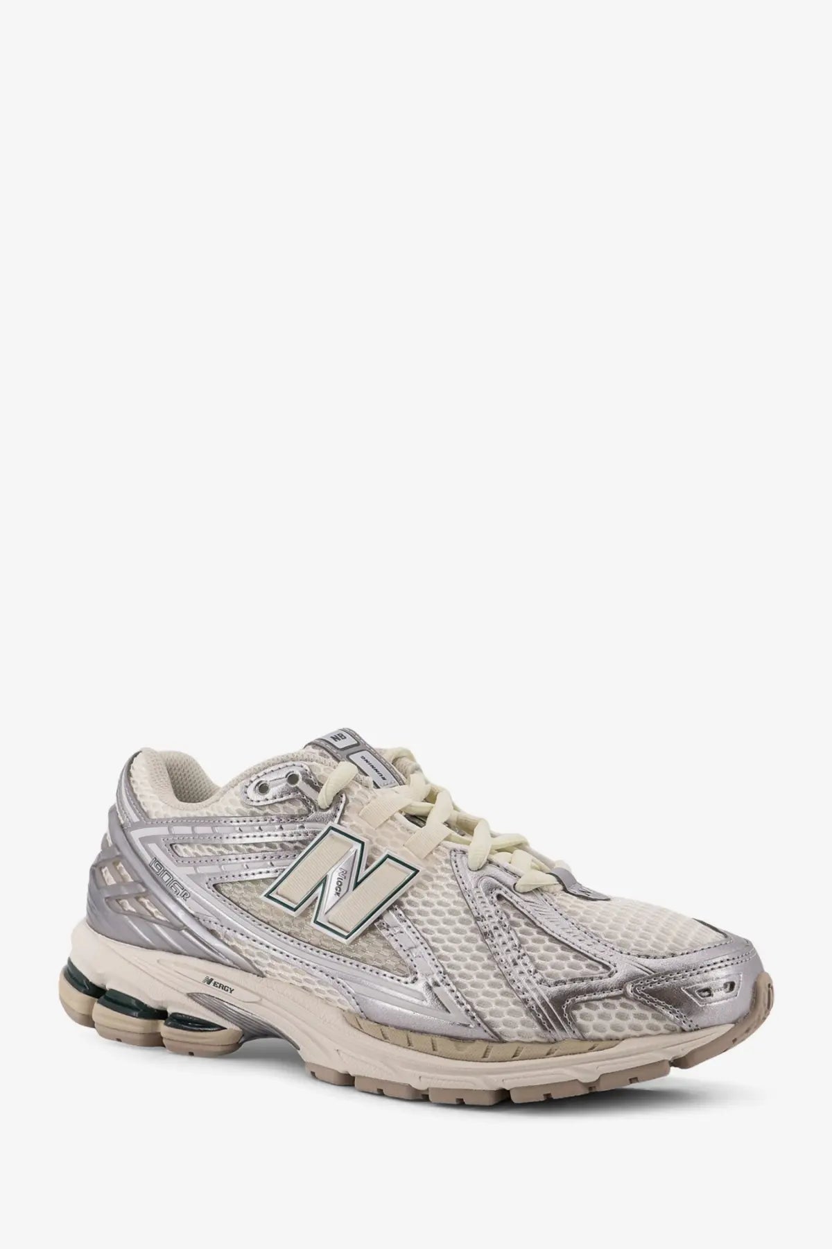 New balance men’s mesh sneakers silver featuring silver and off-white mesh upper with metallic overlays and cushioned sole