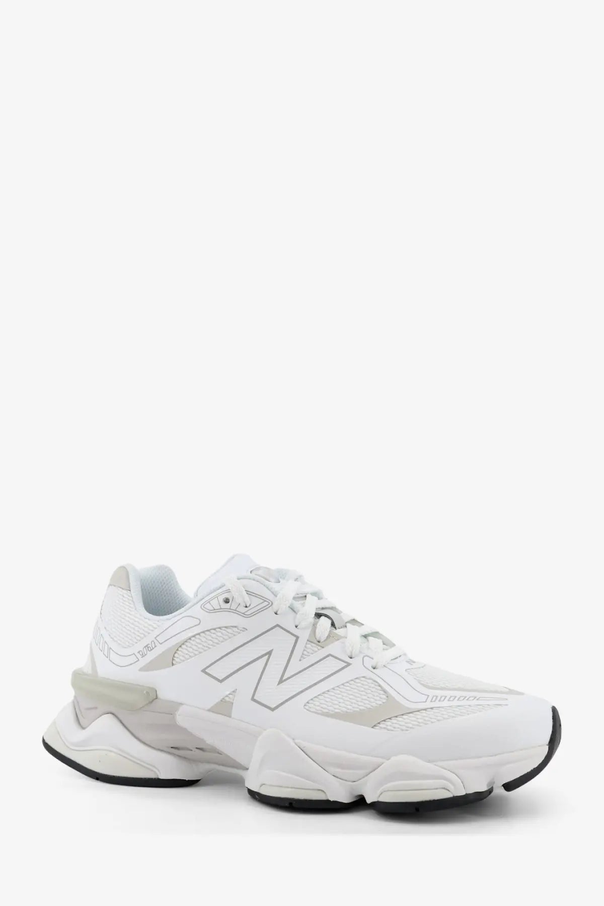 New Balance men’s mesh sneakers in white with chunky layered sole and subtle gray accents for casual wear