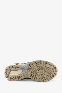 New Balance men’s mesh sneakers white with a sleek design silver and black upper beige rubber sole and red heel accents