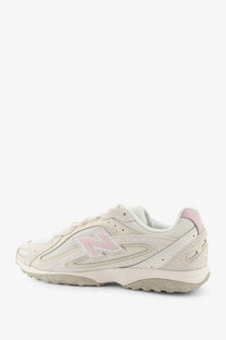 New Balance men’s mesh sneakers white with cream color, soft pink n logo, and breathable mesh upper