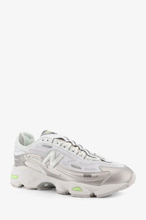 New Balance men’s mesh sneakers white with white silver upper and neon green accents on sole