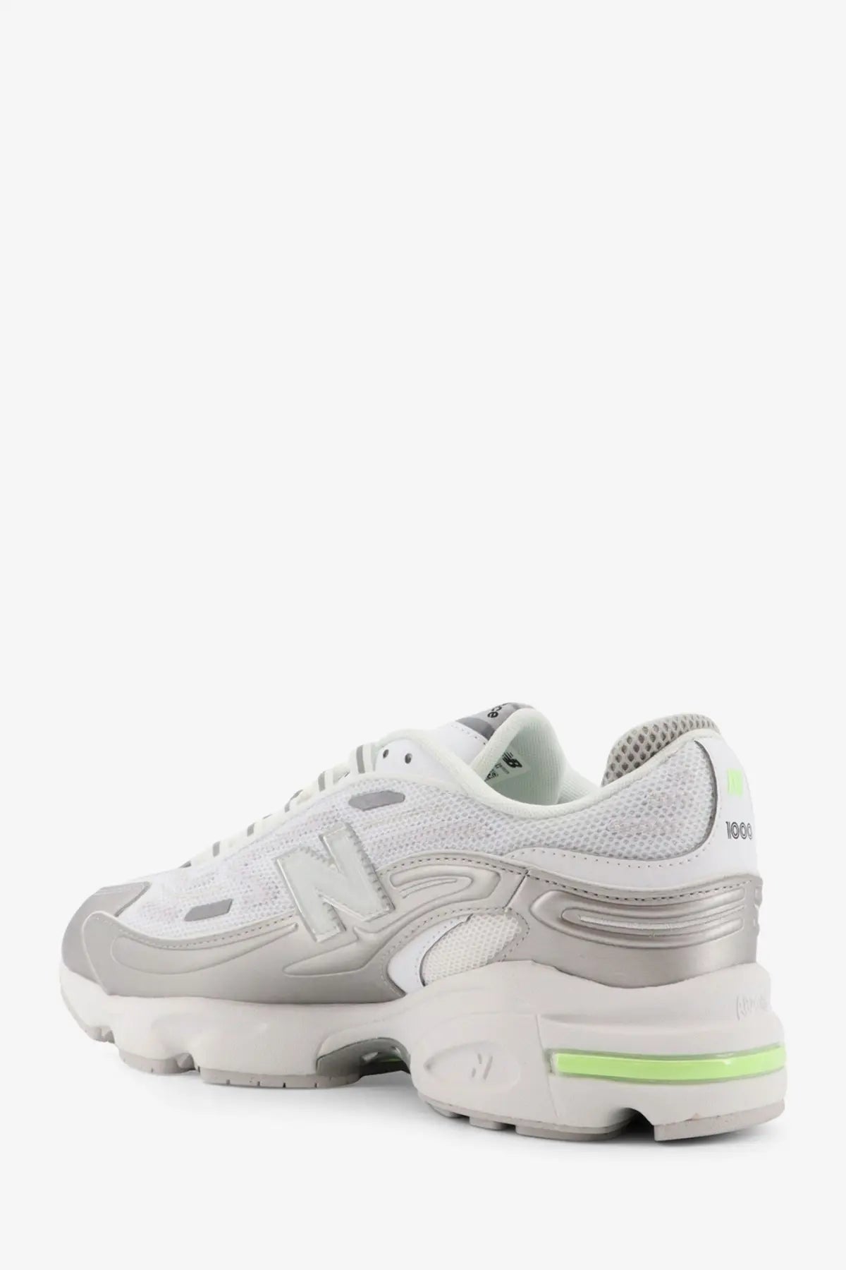 New Balance men’s mesh sneakers white with white and silver design and neon green accents on heel and midsole