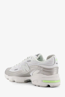 New Balance men’s mesh sneakers white with white and silver design and neon green accents on heel and midsole