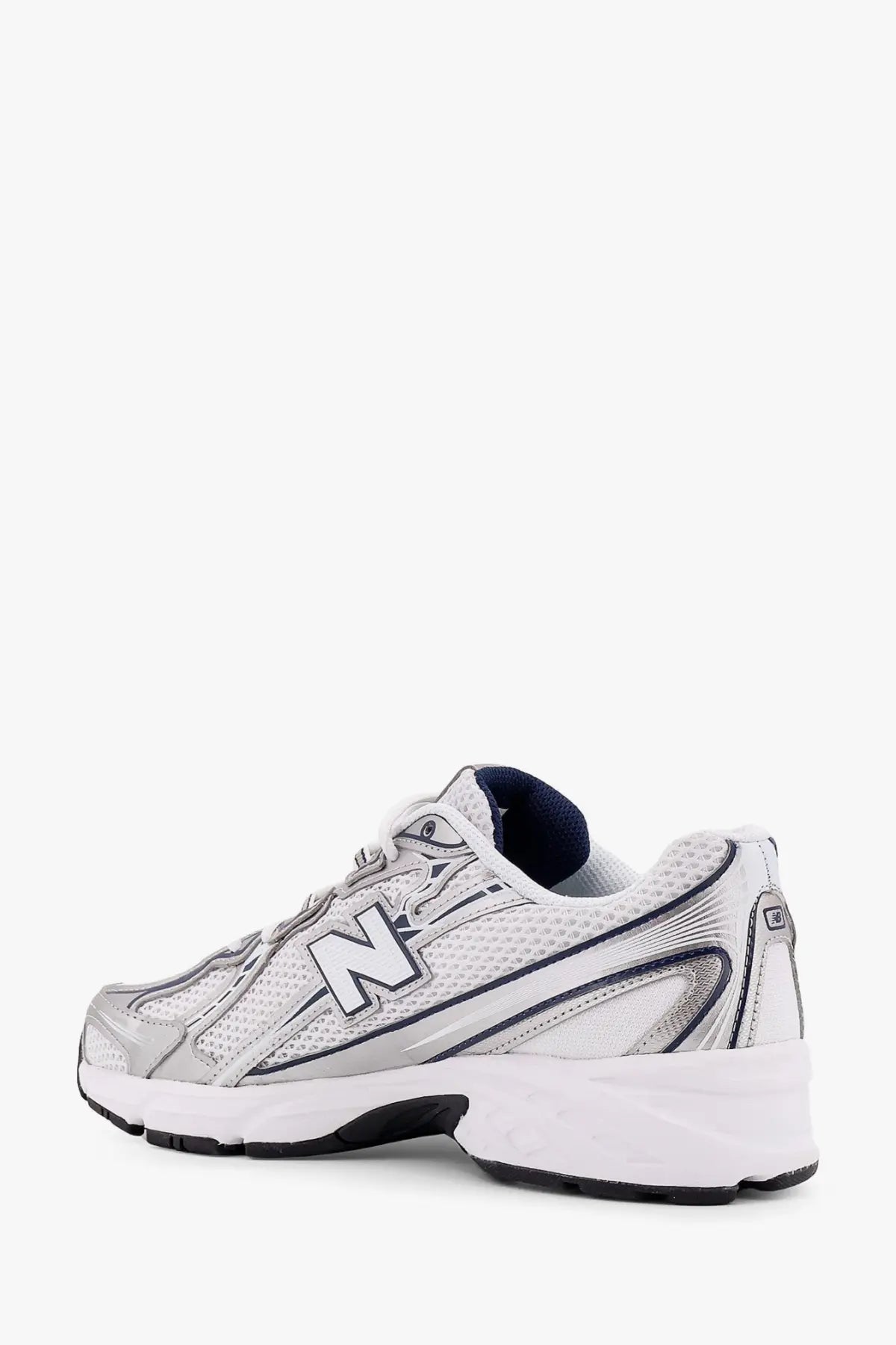 New Balance men’s mesh sneakers in silver and white with black accents and a bold n logo on the side