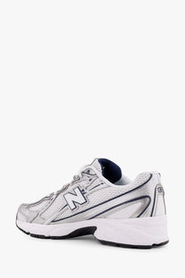 New Balance men’s mesh sneakers in silver and white with black accents and a bold n logo on the side