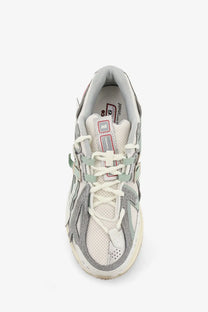 New Balance men’s mesh sneakers white with retro-inspired gray and off-white mesh and suede upper and pink accents