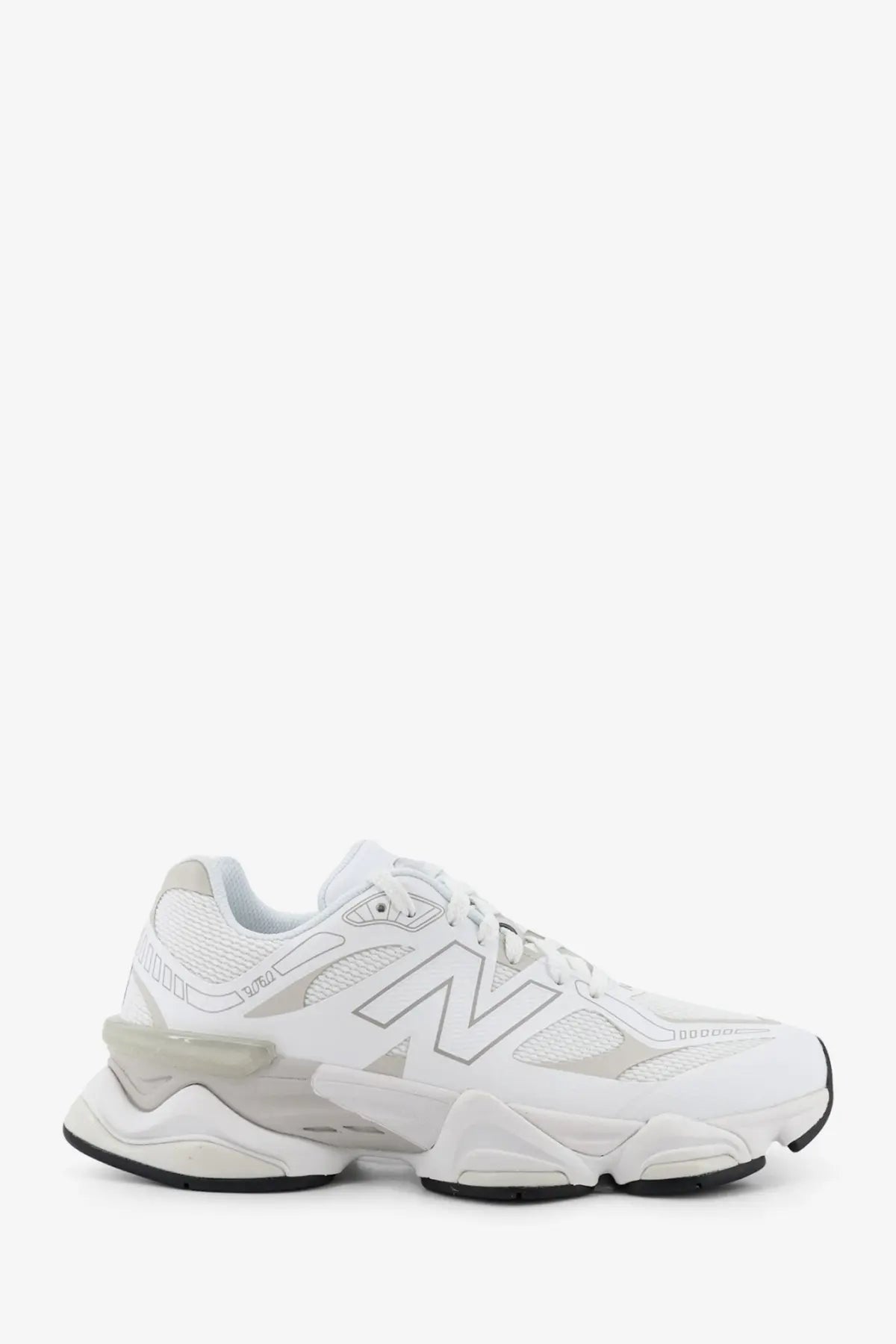 New balance men’s white mesh sneakers with chunky layered sole and breathable mesh upper for casual wear