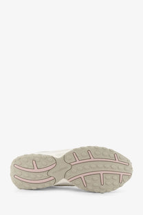 New Balance men’s white mesh sneakers with beige rubber sole and pink accent lines featuring brand name in black
