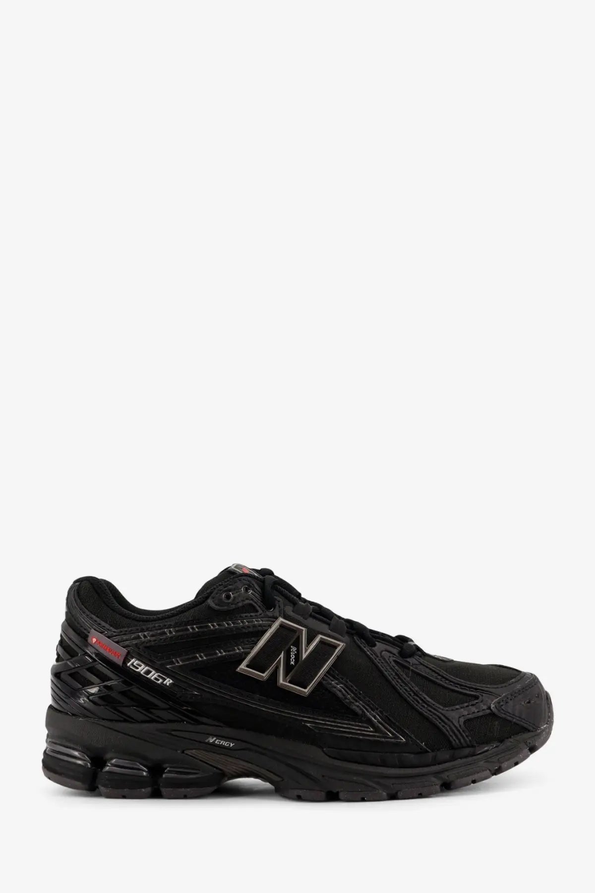 New Balance men’s nylon sneakers black featuring sleek black 1906r running shoe with minimalist design and gray n logo accents
