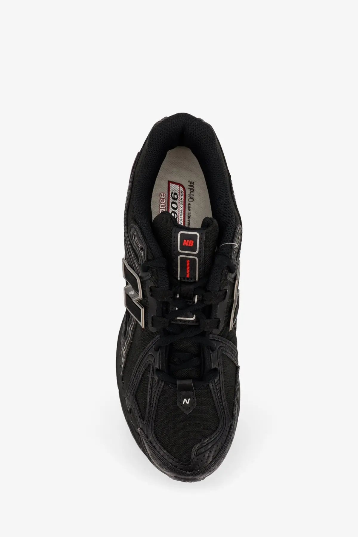 New Balance men’s black 906 nylon sneakers with mesh and synthetic overlays featuring red branding accents on tongue tag