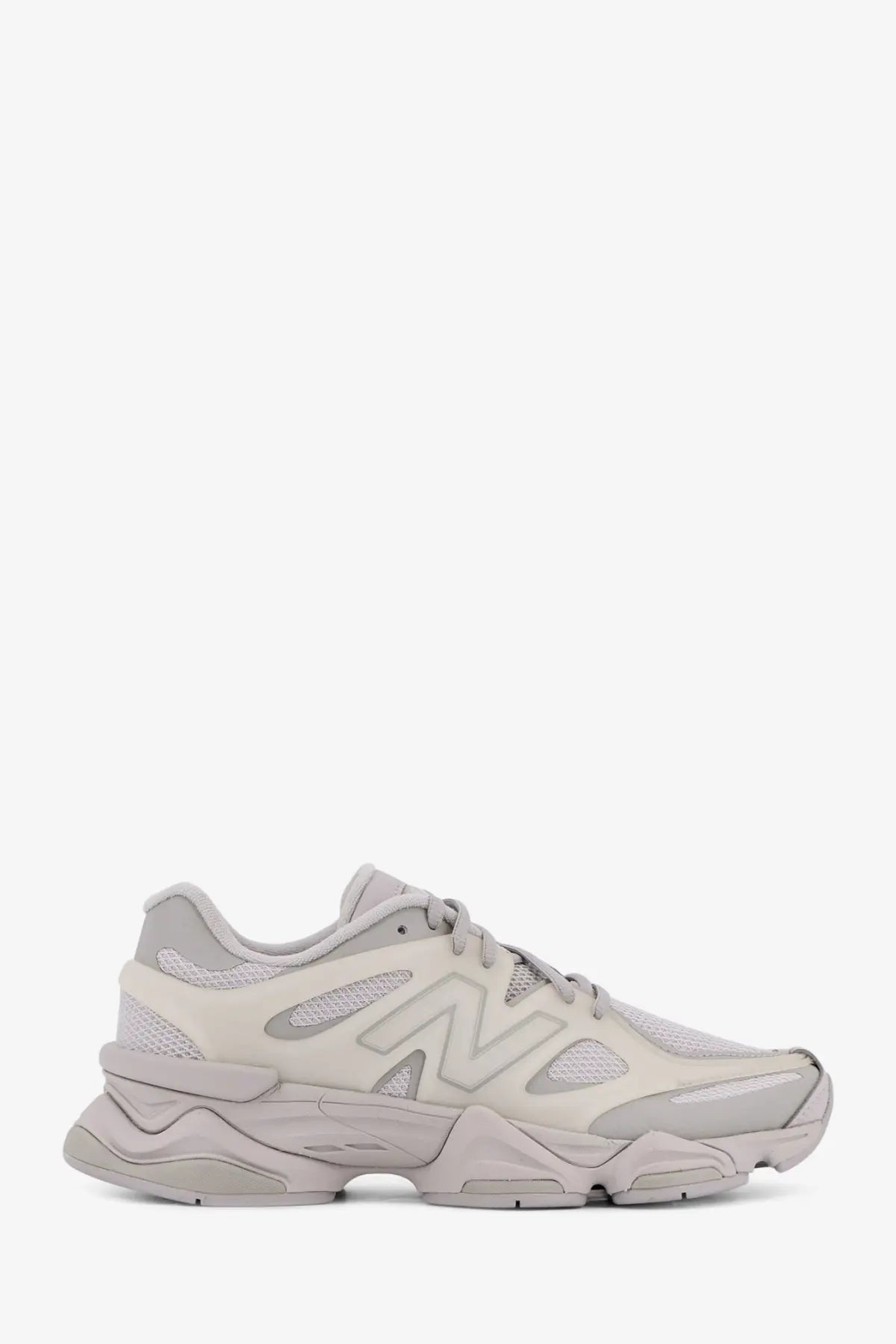 New Balance men’s beige nylon sneaker with chunky layered sole and breathable mesh upper in grey tones