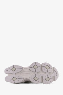 Gray rubber sole with chunky segmented design and diamond-shaped tread pattern on new balance men’s nylon sneakers gray