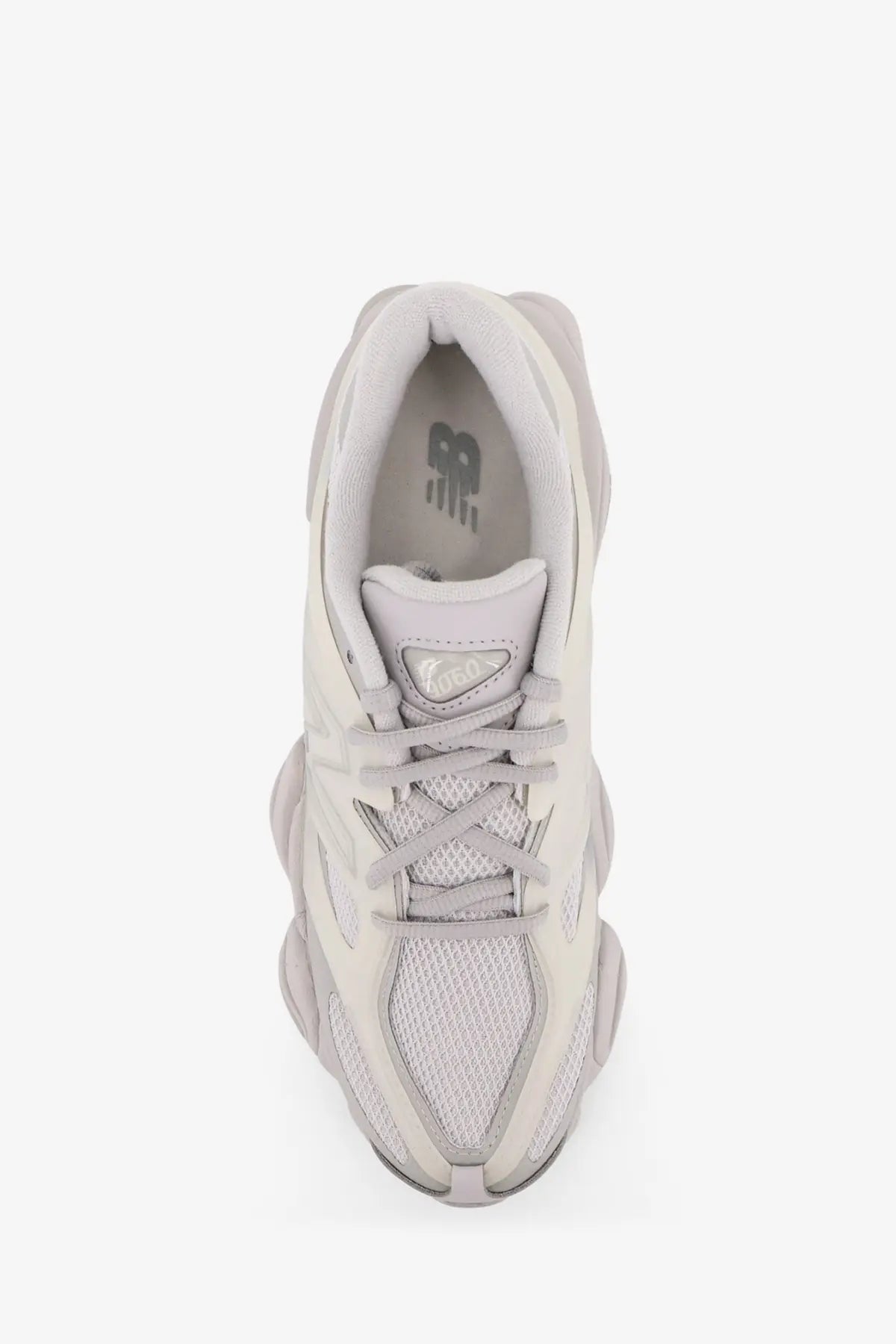New Balance men’s nylon sneaker in grey with a light gray mesh upper and chunky layered sole