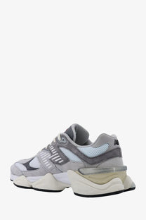 New balance men’s sneakers in grey mesh and suede with a chunky layered sole design