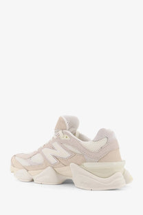 Beige new balance men’s low top sneaker with suede and mesh upper and chunky white rubber sole
