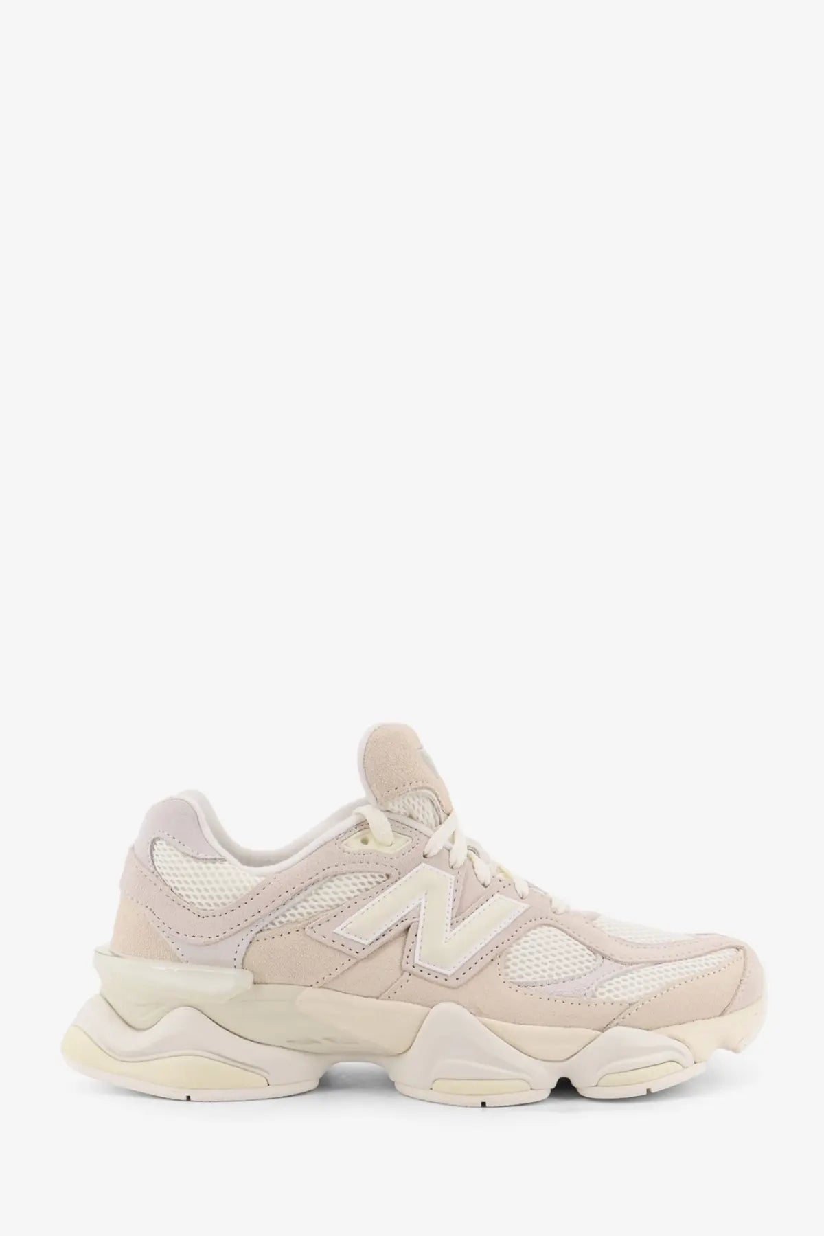 Beige new balance men’s suede and mesh low top sneaker with chunky layered sole and leather upper