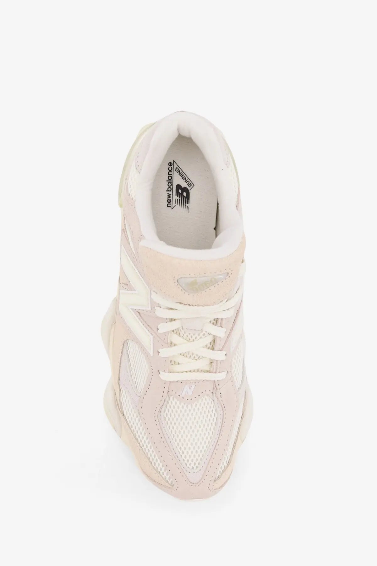 New Balance men’s suede and mesh low top sneaker in pale pink with white laces and chunky rubber sole