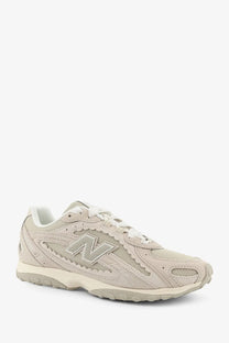 Beige new balance 620 sneaker with mesh and suede upper white laces and matching midsole for men