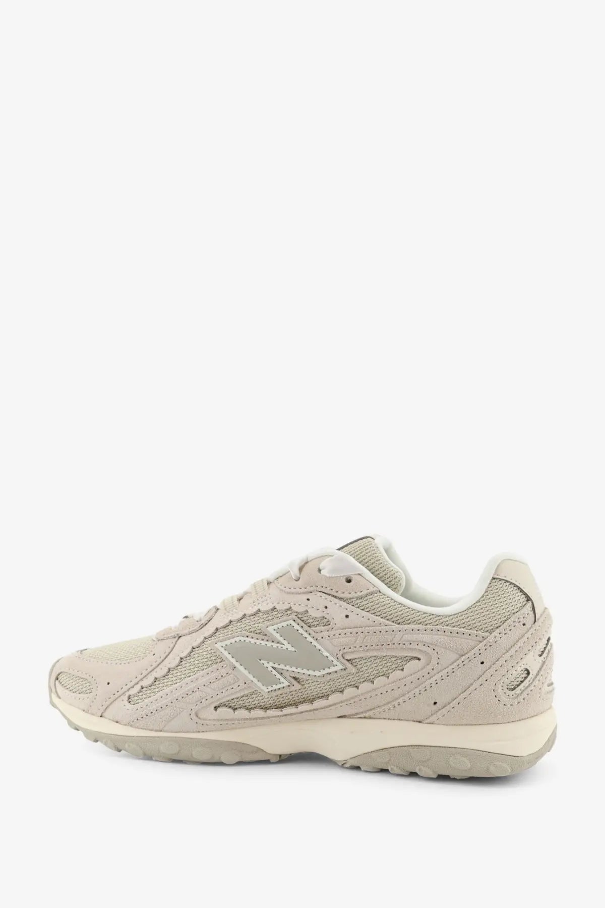 New balance men’s green sneaker with beige suede and mesh upper and gray logo accent