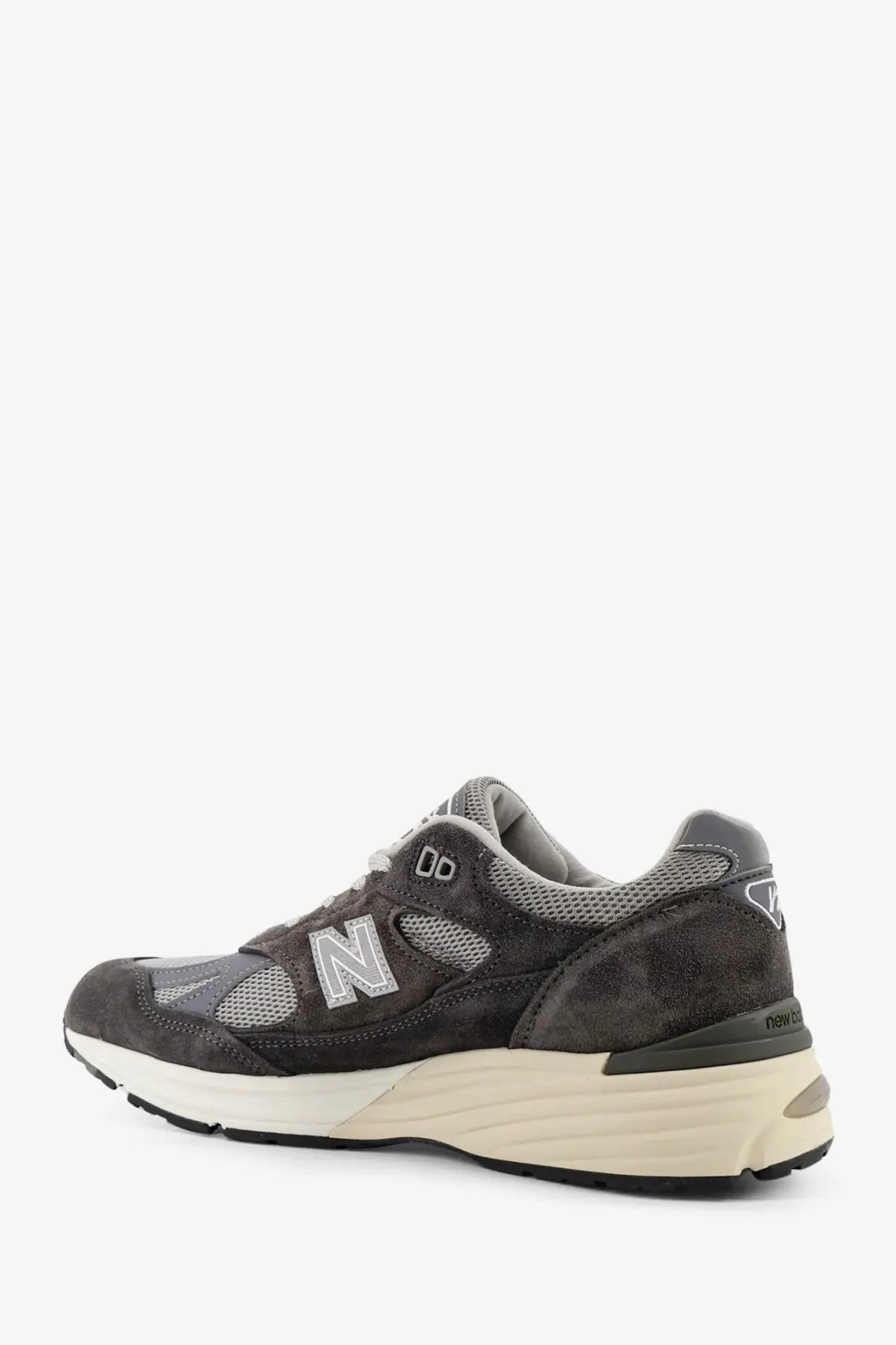New Balance men’s dark gray suede and mesh sneakers with cream midsole in the 990v3 style
