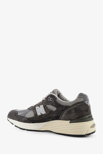 New Balance men’s dark gray suede and mesh sneakers with cream midsole in the 990v3 style