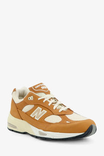 New Balance men’s tier leather sneaker in beige with tan and cream suede mesh upper and cushioned midsole