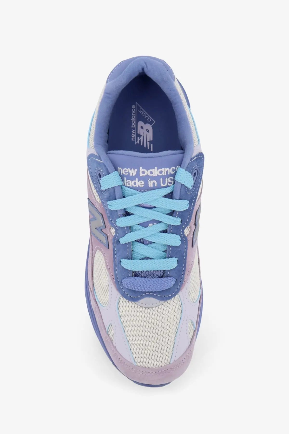 New Balance unisex mesh and suede sneaker in pastel blue and lavender with white rubber sole and light blue laces