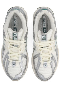 New balance unisex sneaker 1906r silver in white and silver with mesh uppers and metallic accents for running