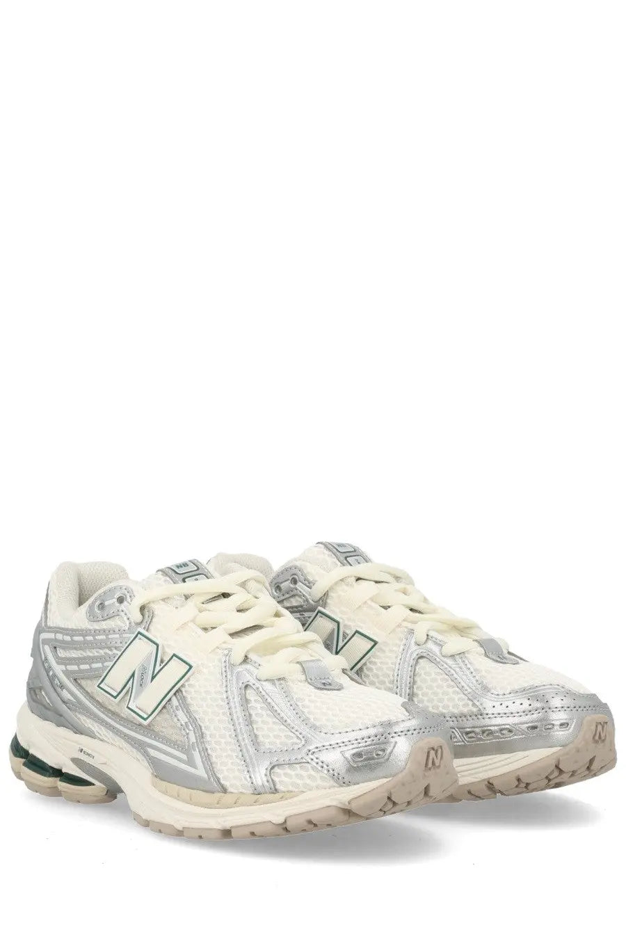 White and silver new balance 2003 sneaker with mesh upper metallic accents and beige rubber sole for unisex use