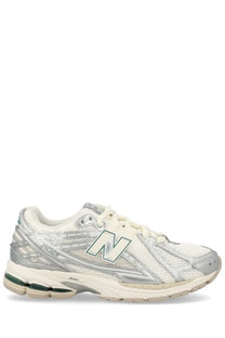 New Balance unisex sneaker 1906R silver with white and silver mesh upper metallic accents and green sole detailing