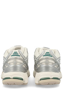 New Balance unisex sneaker 1906r silver with silver and white mesh upper teal accents and translucent midsole