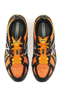 New balance unisex sneaker 610v1 yellow in orange and black with bright yellow laces designed for running